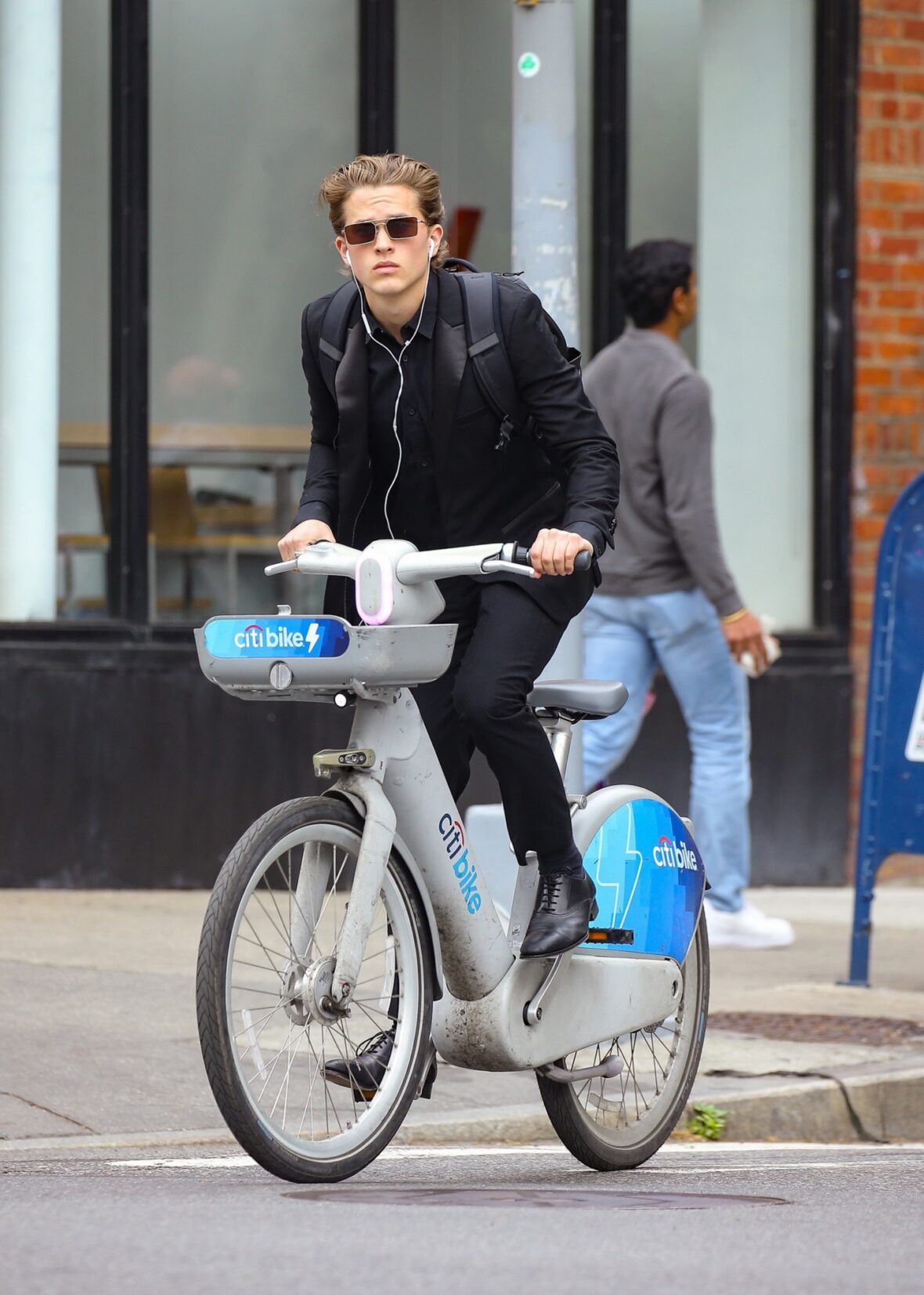 Deacon Phillippe riding a bike in NYC