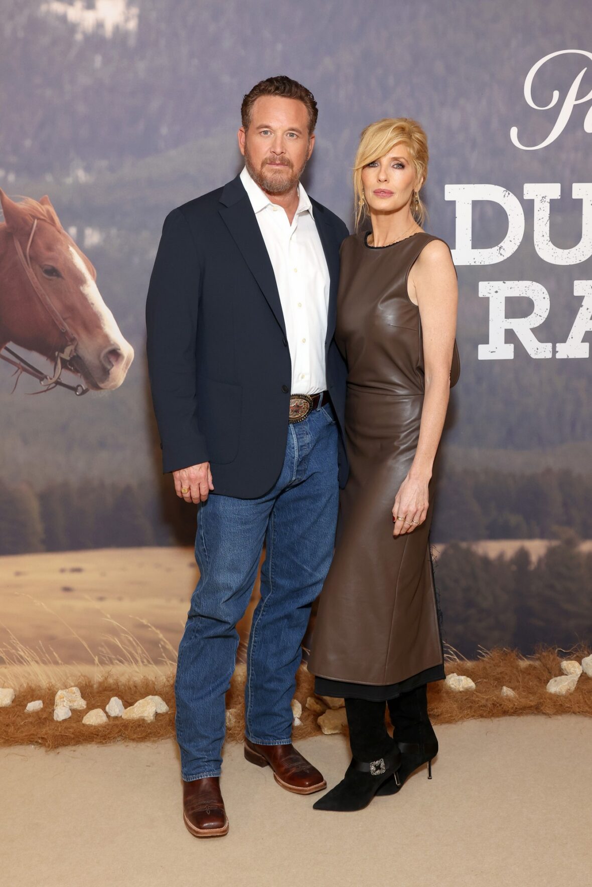 Cole Hauser and Kelly Reilly pose together at the 