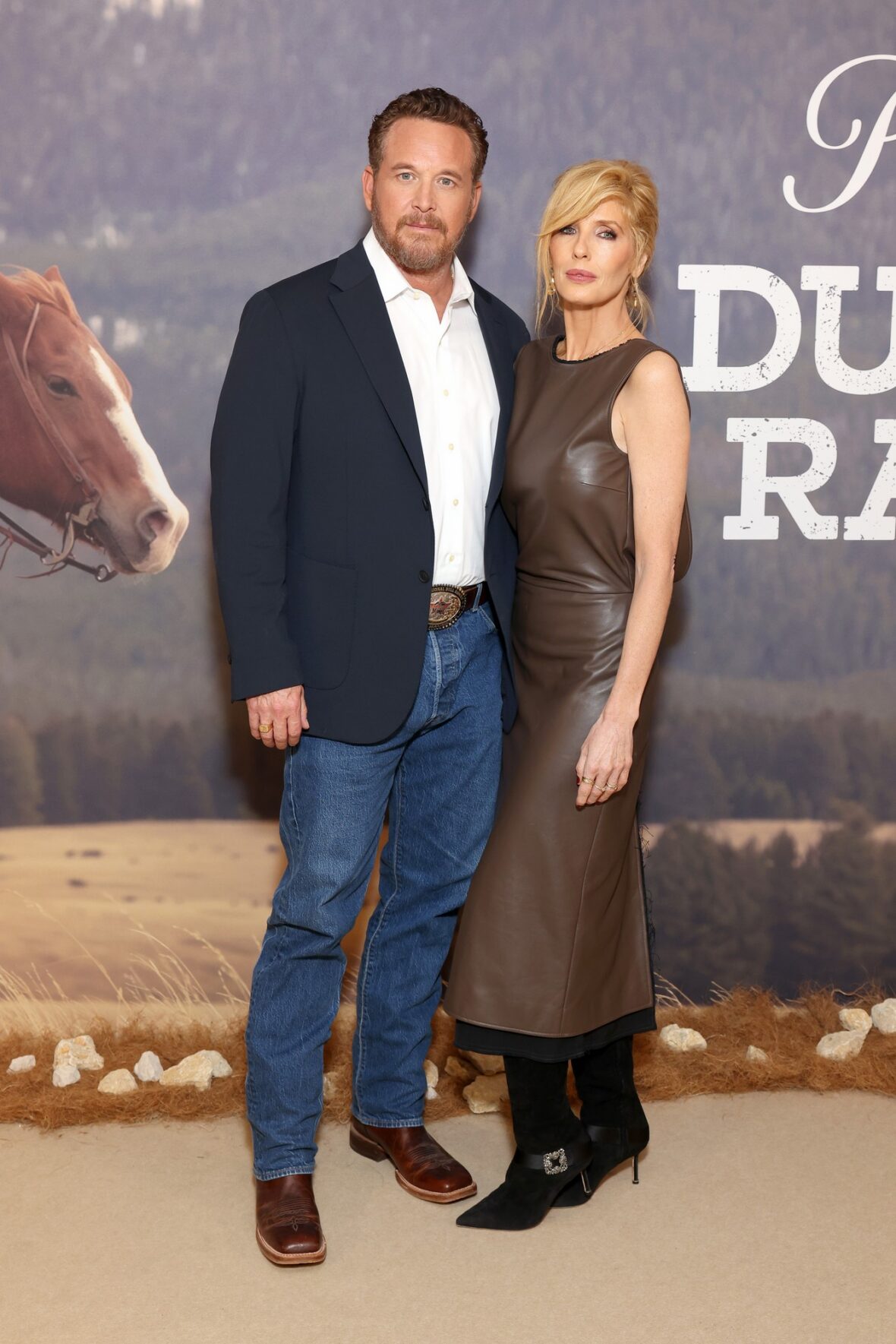 Cole Hauser and Kelly Reilly pose together at the 