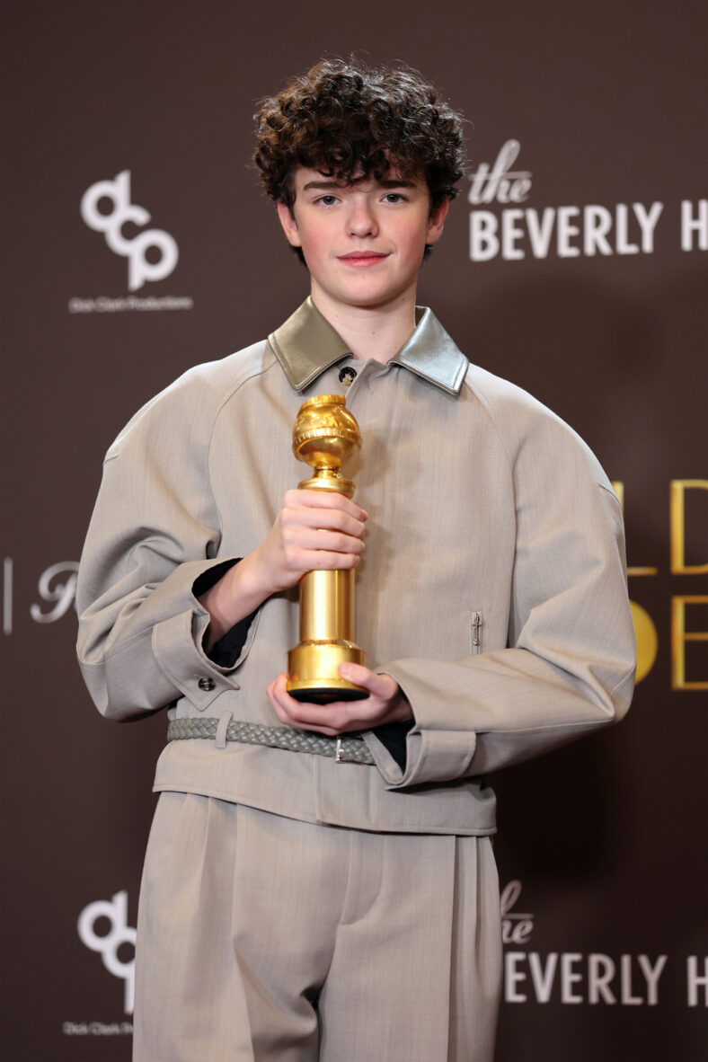 Owen Cooper holding his Golden Globe