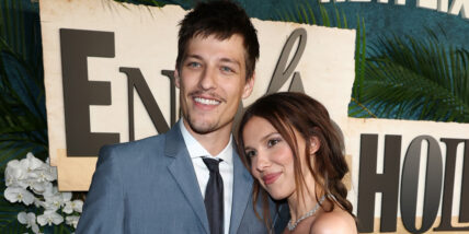 Millie Bobby Brown and husband Jake Bongiovi posing on the red carpet