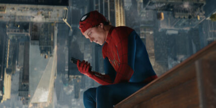 Spider-Man Brand New Day photo featuring Tom Holland in the Spidey-suit on his phone