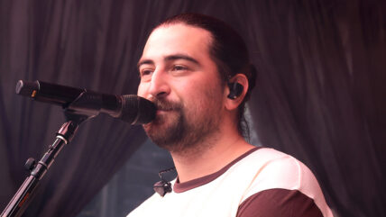 Noah Kahan performing at a show