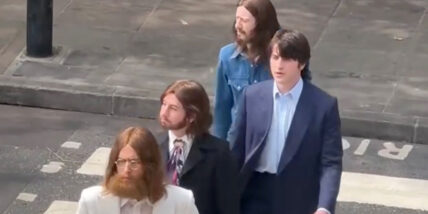 Harris Dickinson (John Lennon), Paul Mescal (Paul McCartney), Barry Keoghan (Ringo Starr) and Joseph Quinn (George Harrison) recreating the iconic Beatles Abbey Road moment in a candid photo while filming their biopics