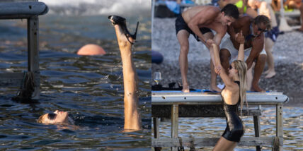 Brooks Nader in the water with her clothes and heels on in August 2026 in Italy