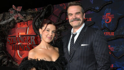 Millie Bobby Brown and David Harbour pose together at Stranger Things' final season premiere