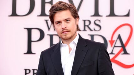 Dylan Sprouse poses at the The Devil Wears Prada 2 premiere