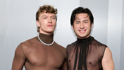Connor Storrie and Hudson Williams posing together