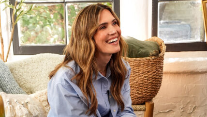 Mandy Moore poses on a couch