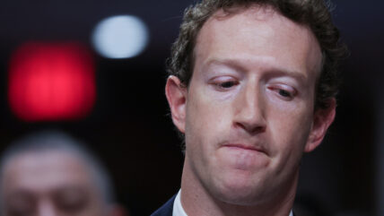 Mark Zuckerberg looking down