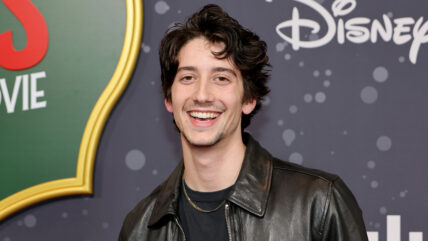 Milo Manheim poses at the A Very Jonas Christmas Movie premiere