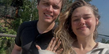 Karis Cameron announcing her engagement in a selfie with Ty Wood, showing her engagement ring
