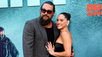Jason Momoa and Adria Arjona on the red carpet at Onslaught premiere
