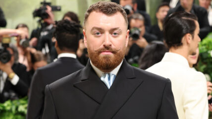 Sam Smith in a black suit.