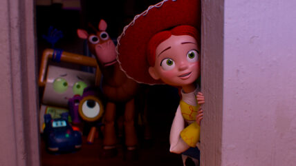 A still from "Toy Story 5" showing Jessie and other toys peeking around a door.