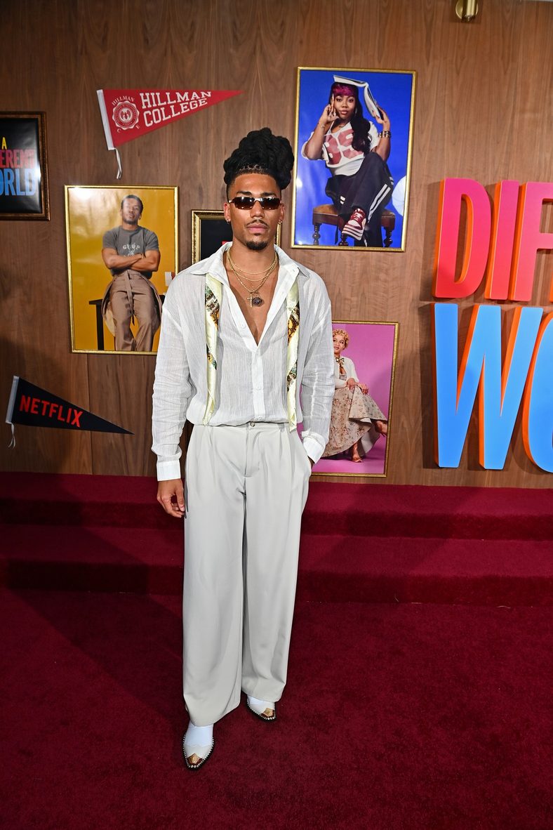 Cornell Young IV poses on the red carpet at the A Different World premiere