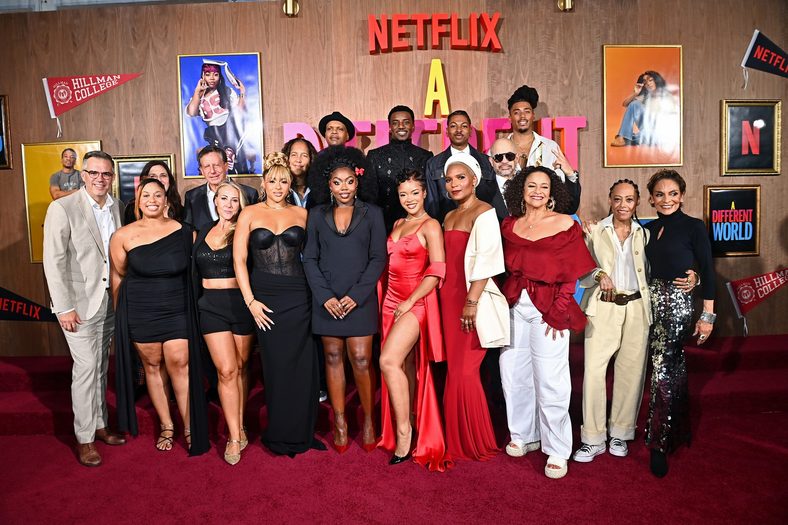 Cast and crew pose for a group photo at the A Different World premiere