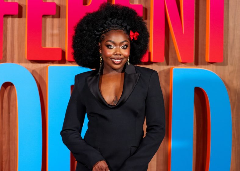 Alijah Kai poses on the red carpet at the A Different World premiere