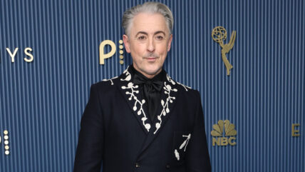 Alan Cumming in a black suit at the Emmys.