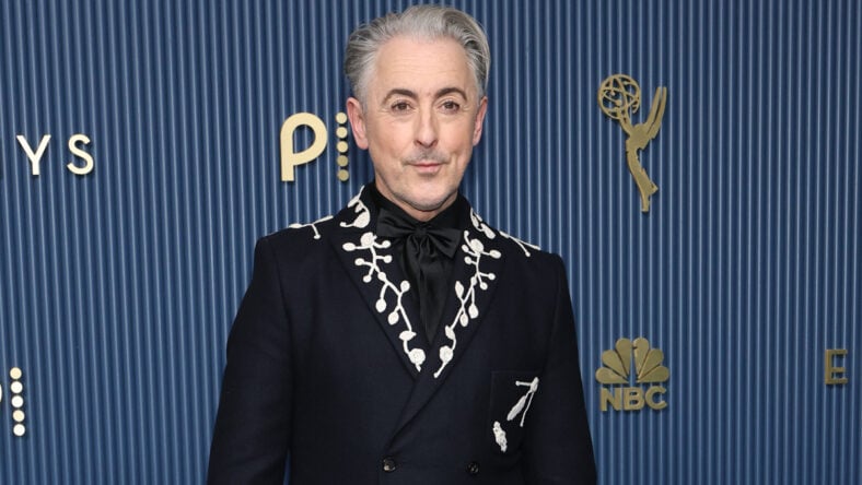 Alan Cumming in a black suit at the Emmys.