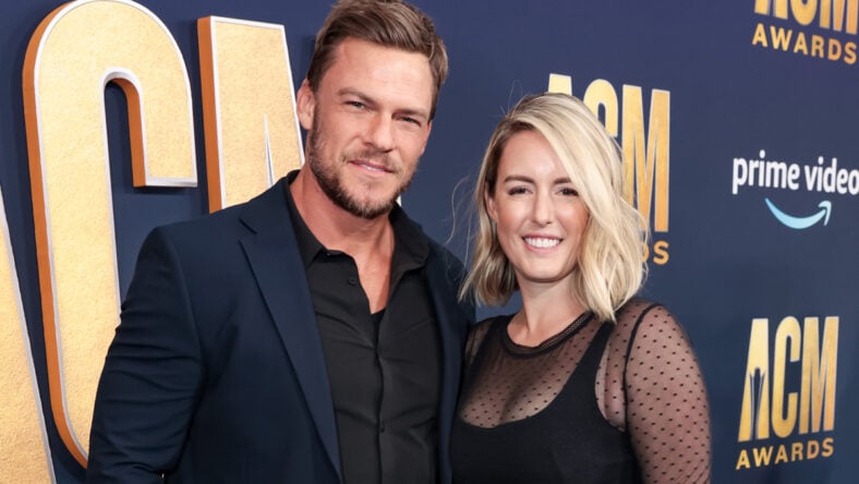 Alan Ritchson and Catherine Ritchson pose for photo together at Reacher premiere.