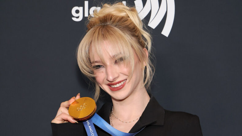 Amber Glenn poses with her Olympic medal