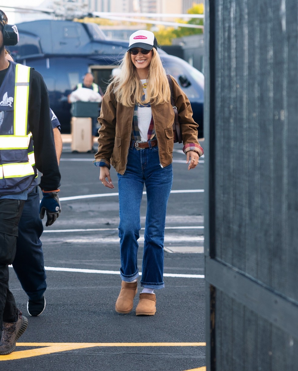 Bella Hadid in a casual, layered look featuring jeans and UGG boots in New York.