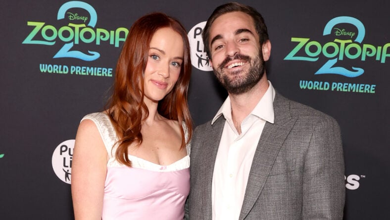 Whitney Leavitt in a pale pink dress poses alongside husband Conner Leavitt at Zootopia 2 premiere.