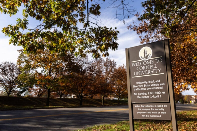 Cornell University sign surrounded by trees
