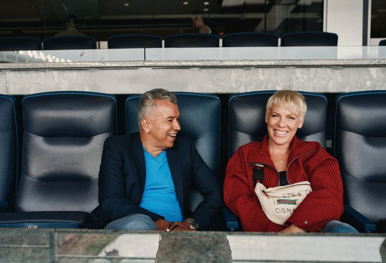 Sergio Trujillo and Pink pose in seats at Yankee Stadium