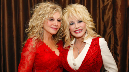 Stella and Dolly Parton pose backstage at the Red Tent Women's Conference 2014