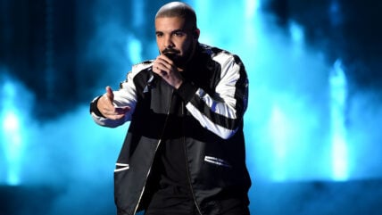 Drake performs on stage.