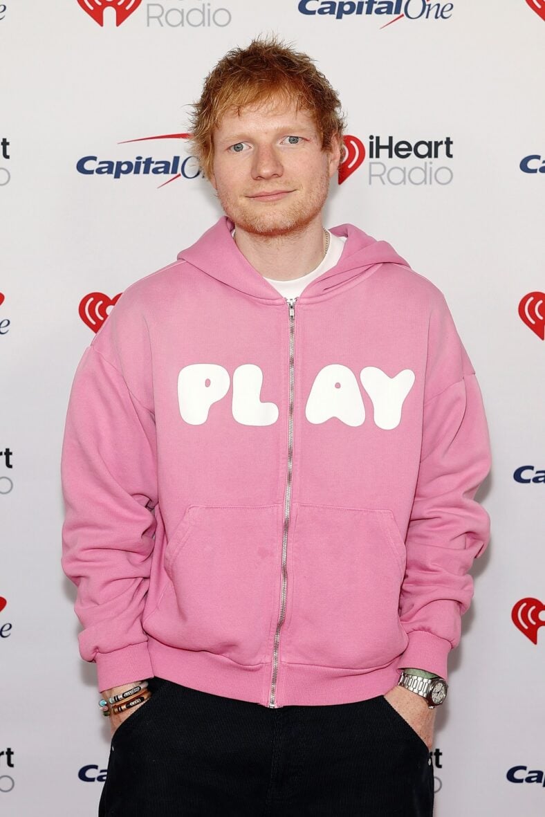 Ed Sheeran poses on the red carpet at iHeartRadio Jingle Ball tour