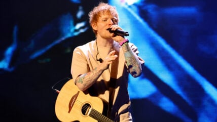 Ed Sheeran performing on stage