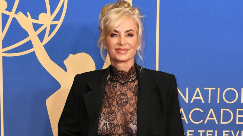 Eileen Davidson attends the Daytime Emmys in a sheer black blouse and coordinating blazer.