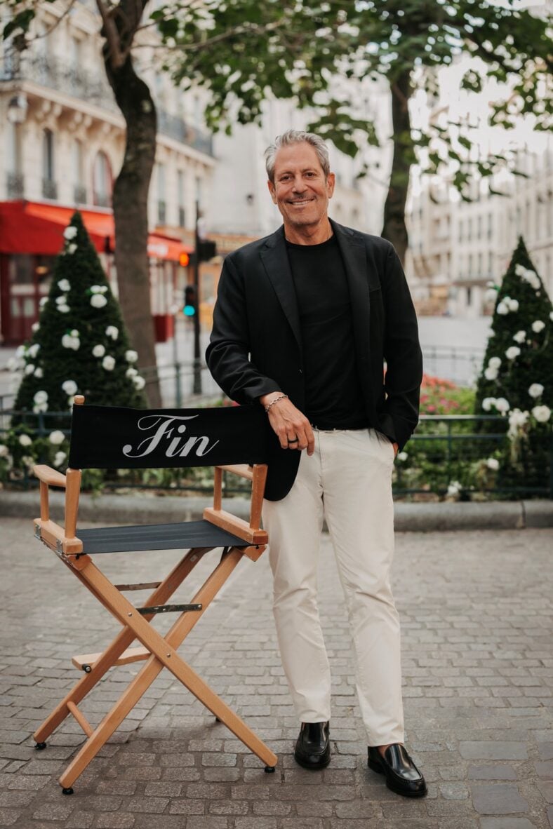 Darren Star poses for a photo on set of Emily In Paris