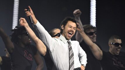 Harry Styles performing on stage