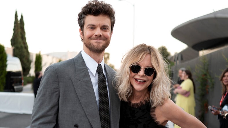 Jack Quaid and Meg Ryan pose together at a museum opening.