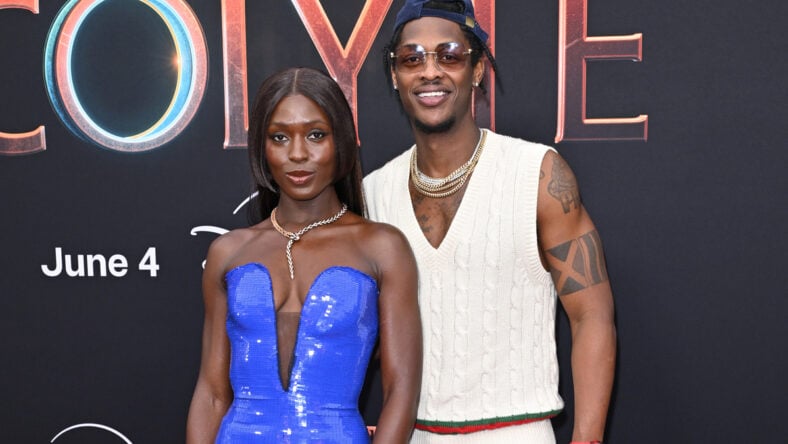 Jodie Turner-Smith in a blue dress with her brother Richard Smith at the Acolyte premiere.