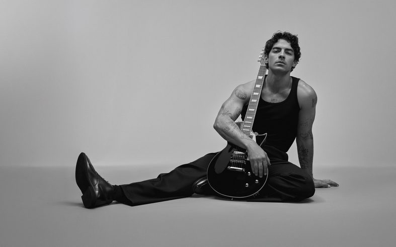 Joe Jonas poses with a guitar for Kenneth Cole's Inspire campaign