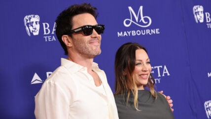 Tom Pelphrey and Kaley Cuoco pose at the BAFTA TV Tea Party