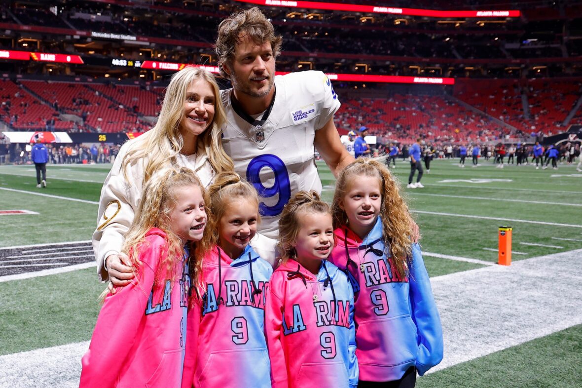 Kelly Stafford and Matthew Stafford together in a stock image from his NFL career