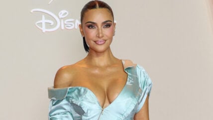 Kim Kardashian at a Disney event in a light blue low-cut dress.