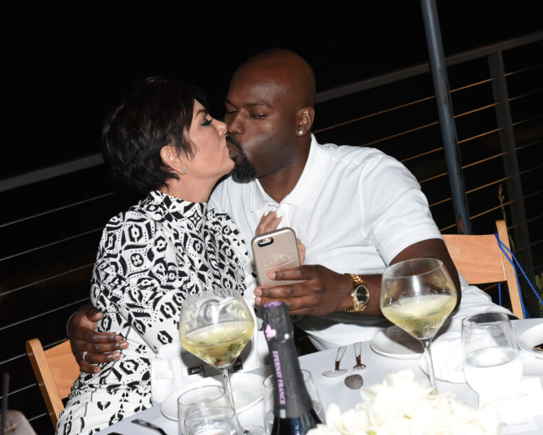 Kris Jenner and Corey Gamble kiss during 2015 appearance