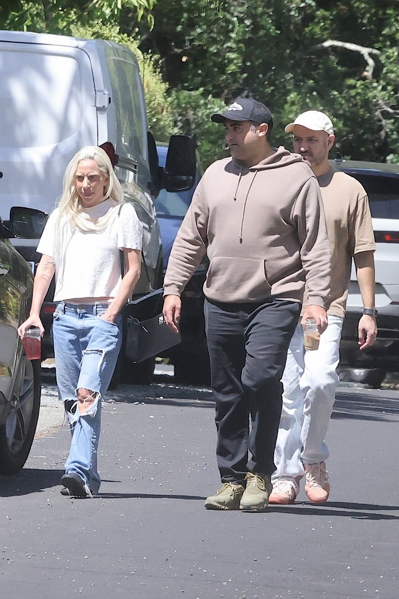 Lady Gaga wears jeans and a T-shirt while walking alongside Bobby Campbell and Michael Polansky