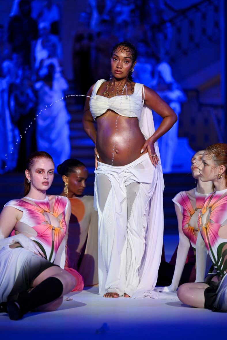 Leigh Anne Pinnock modeling at the Di Petsa show in London, England on September 21. She's wearing a lactating bra and baring her baby bump