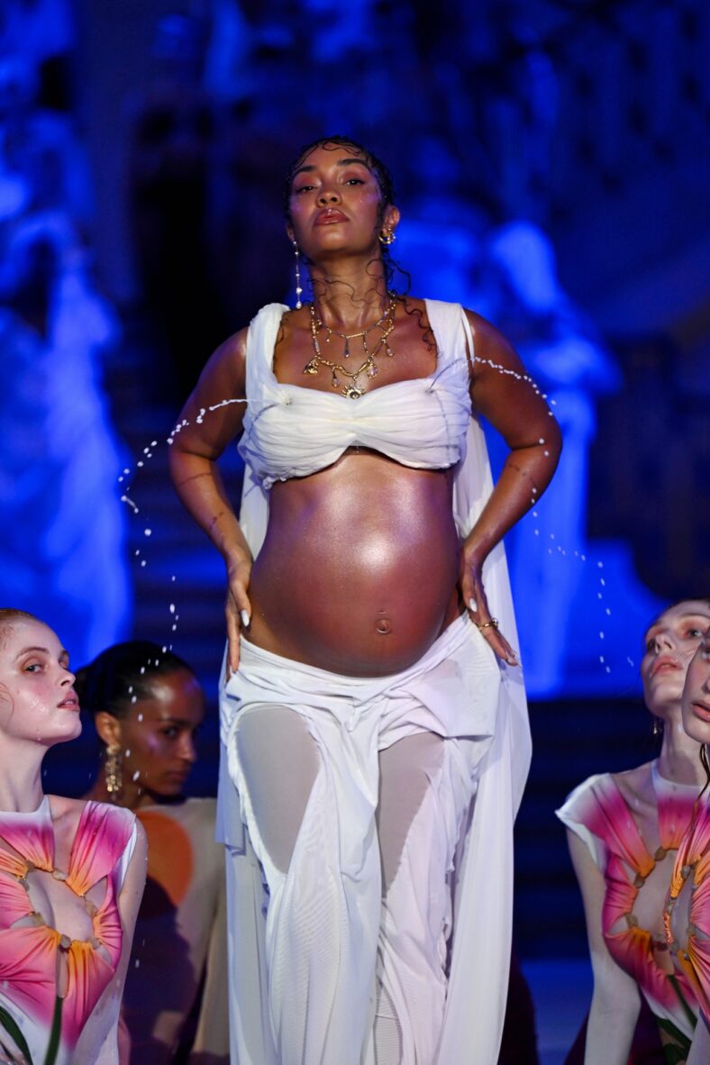 Leigh Anne Pinnock modeling at the Di Petsa show in London, England on September 21. She's wearing a lactating bra and baring her baby bump
