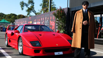 Lewis Hamilton poses while arriving at the Italian GP in Monza