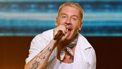 Macklemore performing on stage