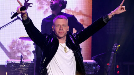 Macklemore stock image of him performing from 2019